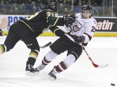 London Knight Julius Bergman knocks over Pius Suter of the Guelph Storm   during their OHL hockey game  in London, Ontario on Friday, February 27, 2015. DEREK RUTTAN/London Free Press