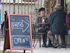 Judy Sholdice, her chihuahua Josie and husband Richard enjoy a warm day on the patio at the Black Walnut Cafe in London, Ont. in this 2016 file photo. Derek Ruttan/The London Free Press/Postmedia Network