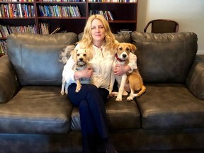 Laura Sparks, executive director of the Huron Women’s Shelter in Goderich, with the shelter’s ambassadors for the Pets In Shelter program, Sawyer and Poppy.