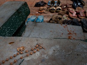 Footwear and personal belongs of victims kept close to the scene of a suicide bombing at St. Sebastian Church in Negombo, Sri Lanka, Monday, April 22, 2019.
