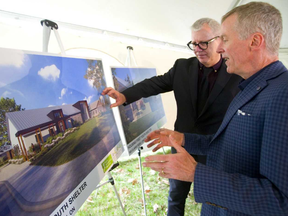 Youth Opportunities Unlimited (YOU) executive director Steve Cordes, right, talks about its new youth shelter on Clarke Road with MP Adam Vaughan. Vaughan announced $2.96-million in funding for the 30-bed shelter on Thursday. (Mike Hensen/The London Free Press)