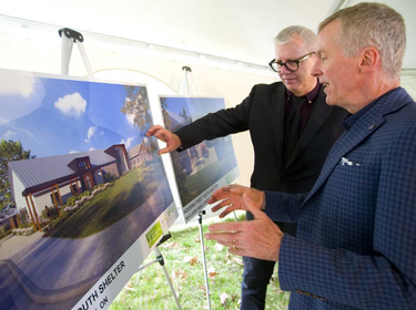 Youth Opportunities Unlimited (YOU) executive director Steve Cordes, right, talks about its new youth shelter on Clarke Road with MP Adam Vaughan. Vaughan announced $2.96-million in funding for the 30-bed shelter on Thursday. (Mike Hensen/The London Free Press)