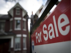 A for-sale sign outside a home.