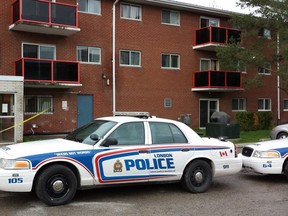 Police maintained a heavy presence outside 165 Connaught Ave. on Monday. They would not confirm reports of a stabbing. (DAN BROWN, The London Free Press)