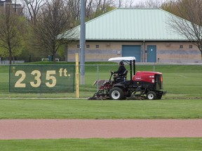 Grass is cut at the North London Athletic Fields on Thursday. It's one of many waterlogged city parks that has been closed to any sporting activity this month, despite the traditional May 1 opening for soccer fields and baseball diamonds. (MEGAN STACEY/The London Free Press)