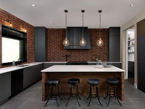 Brick walls warm up the kitchen and make the grey cabinets, wood island and quartz counters pop in contrast.
  PHOTOS: WILLIAM CHAN