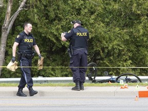 Police gather evidence at the scene of hit and run in Tillsonburg. (Derek Ruttan/Postmedia Network)