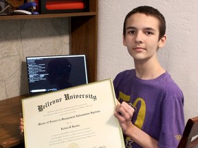 Kelton Kostis displays the Master of Science in Management Information Systems he recently earned online from Bellevue University in Bellevue, Nebraska. (Paul Morden/Sarnia Observer)