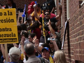 Supporters of Venezuelan opposition leader Juan Guaido block a back entrance of the Embassy of Venezuela May 2, 2019 in Washington, DC. (Photo by Alex Wong/Getty Images)