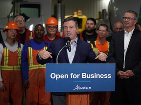 Alberta Premier Jason Kenney (middle) and Alberta Finance Minister Travis Toews (right) announced at Lafarge Infrastructure in Edmonton on Monday May 13, 2019 that their government plans to create jobs in the province by having the lowest corporate business tax rate in Canada. (PHOTO BY LARRY WONG/POSTMEDIA)