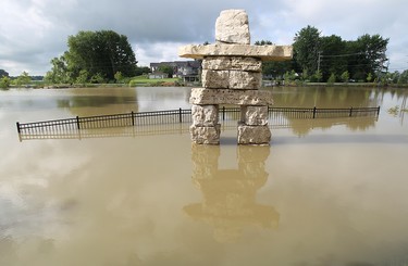 AMHERSTBURG, ONT.: AUGUST 9, 2011 -- Water floods the area around a small pond after rain caused flooding in several areas of Amherstburg on Tuesday, August 9, 2011. (TYLER BROWNBRIDGE / The Windsor Star)