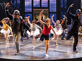 Nolen Dubuc (centre) as Billy Elliot with members of the company in Billy Elliot the Musical. (Photography by Cylla von Tiedemann)