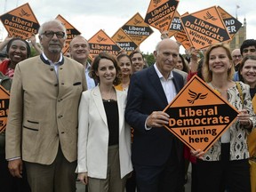 Liberal Democrats leader Sir Vince Cable, second right, is joined by activists and the party's three new MEPs, from left, Dinesh Dhamija, Luisa Porritt and Irina von Wiese, as they celebrate the best ever European Election result in the party's history in central London, Monday, May 27, 2019. With results announced Monday for all regions in the U.K. except Northern Ireland, the Brexit Party had won 29 of the 73 British EU seats up for grabs and almost a third of the votes. On the pro-EU side, the Liberal Democrats took 20% of the vote and 16 seats _ a dramatic increase from the single seat in won in the last EU election in 2014. (Kirsty O'Connor/PA via AP)