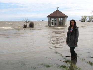 Mary Shadd stands in a flooded section of the backyard of her Shrewsbury, Ont. home on Wednesday that backs onto Rondeau Bay. (ELLWOOD SHREVE/Chatham Daily News)