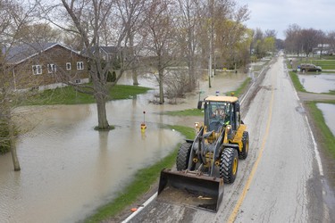 WHEATLEY, ONT:. May 1, 2019 - A bulldozer is used to clear debris from Cotterie Park Rd. as waterfront homes continue to flood, Wednesday, May 1, 2019.  (DAX MELMER/Windsor Star)