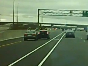 A car, believed to be a Ford Focus, brakes after cutting in front of a slower-moving vehicle on Hwy. 410 at the 407 on May 3, 2019, causing the other vehicle to crash.