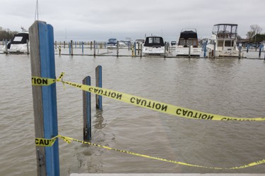 WINDSOR, ONT:. MAY 3, 2019 -  Yellow caution tape blocks access to a boardwalk at the boat launch at Lakeview Park Marina due to high water levels, Friday, May 3, 2019.  (DAX MELMER/Windsor Star)