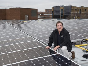 Thomas Davis, professor in Fanshawe College's Donald J. Smith School of Building Technology has installed 600 photovoltaic panels  on the roof of the college's H-Building in London. (Derek Ruttan/The London Free Press)