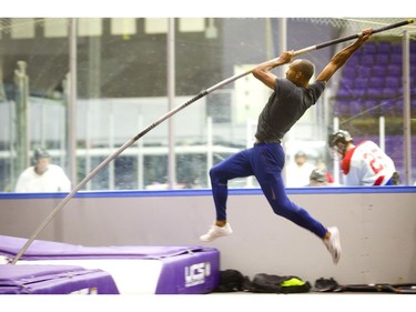 Decathlete Damian Warner practises the pole vault practice in Western University's Thompson Arena in London on Wednesday. (Mike Hensen/The London Free Press)