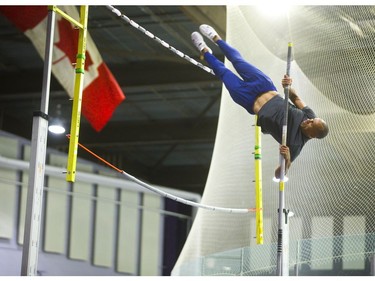 Decathlete Damian Warner practises the pole vault in Western University's Thompson Arena in London on Wednesday. (Mike Hensen/The London Free Press)
