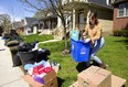 Riley Papp, 21 of London cleans up the mess left by previous tenants as she moves in to a new place near Western. Fleeing Western students left their annual debris on the sides of London streets as the school year runs down in London, Ont.  Mike Hensen/The London Free Press