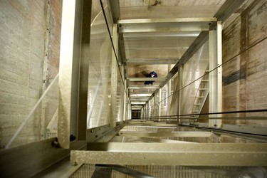 Jeff Cantelon, a dam maintenance worker for the Upper Thames River Conservation Authority (UTRCA) looks up as he works his way down a staircase 30m or nearly 9 floors into the bowels of Fanshawe Dam in London Ontario. Mike Hensen/The London Free Press/Postmedia Network