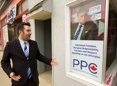 Jordan Kent says that the PPC kicked him out of the running because he's openly gay and that is against the PPC's credo of individual freedom, personal responsibility and fairness and respect. Kent is standing in front of their office on Dundas Street in Woodstock. (Mike Hensen/The London Free Press)