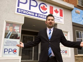 Jordan Kent says that the People's Party of Canada in Oxford kicked him out of the running to be the Oxford candidate because he's openly gay. Kent is standing in front of the party's office on Dundas Street in Woodstock. (Mike Hensen/The London Free Press)