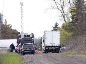 Police vehicles block Lakeshore Line east of Port Burwell Tuesday, May 7, 2019, after a  body and a refrigerator was discovered on a nearby Lake Erie beach at the base of a bluff. Derek Ruttan/The London Free Press