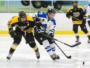 Waterloo Siskins player Brett Schaefer challenges London Nationals player George Diaco for puck possession in the first period of their game at the Western Fair Sports Centre. in London, Ont. on Wednesday May 8, 2019. Derek Ruttan/The London Free Press