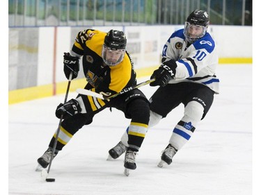 Jeff Schrattner of the Waterloo Siskins gets by Riley McRae of the London Nationals in London, Ont. on Wednesday May 8, 2019. Derek Ruttan/The London Free Press/Postmedia Network