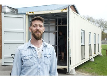 Matt Rock, a teacher at London Christian High, is leading a group of students who are renovating a shipping container into a  mobile computer classroom for children in Tanzania. (Derek Ruttan/The London Free Press)
