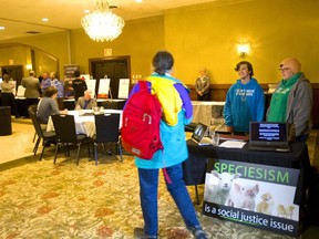 Protesters from Stop Maple Leaf Violence who were upset at the "speciesism" of killing chickens for people to eat, were allowed to set up  a table inside the Maple Leaf Foods open house at the Best Western Lamplighter Inn on Wellington Road on Thursday May 9, 2019.  Matt Schwab, a member of the group, said, "Maple Leaf have a policy of transparency." (Mike Hensen/The London Free Press)