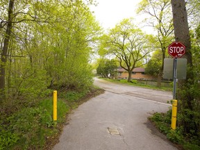 The Thames Valley Parkway comes to an abrupt end at Raymond Avenue at Ross Park in London, leaving cyclists no choice but to hit city streets to make their way over to Adelaide Street. The city is getting close to starting the process of linking the two ends of the pathway with two bridges across the north branch of the Thames River, one leaving Ross Park to enter lands owned by the Sisters of St. Joseph, then a path crossing lands owned by the Boy Scouts of Canada and Western University, before another bridge links up with paths in the North London Athletic Fields off of Adelaide Street. (Mike Hensen/The London Free Press)