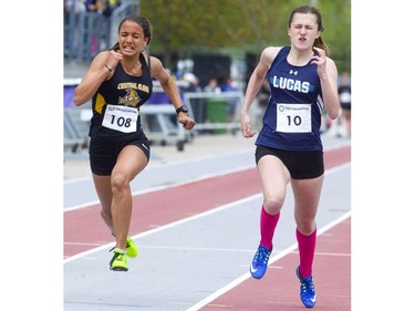 Lucas's Alena Ivanov grits out a one-millisecond win over Tayah De Sousa of Central Elgin in the junior girls 100m dash after DeSousa won the junior girls 80m hurdles at the TVRA track and field meet held on Wednesday at TD Stadium. (Mike Hensen/The London Free Press)