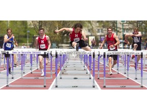 Nathan Hostetler of Medway secondary school in Arva wins the senior boys' 110m hurdles, followed by Bailey Couch of Woodstock Collegiate and Chris Caruso of Oakridge, left, winning the bronze  at the TVRA track and field meet held on Wednesday at TD Stadium. (Mike Hensen/The London Free Press)