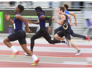 Devonte Ballantyne of CCH wins his 100m senior boys heat over John Baya of RMCat the TVRA track and field meet held on Wednesday at TD Stadium. (Mike Hensen/The London Free Press)