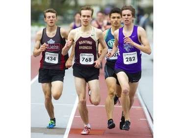 Eric Klassen of Banting took the lead about half way through the senior boys 1500m and held on for the win after running most of the race in a pack with Colson Erb of Lord Dorchester, Kyle Koyangagi of Laurier and Aaron Canfield of Huron Park during the first day of the TVRA track and field meet held on Wednesday at TD Stadium. (Mike Hensen/The London Free Press)