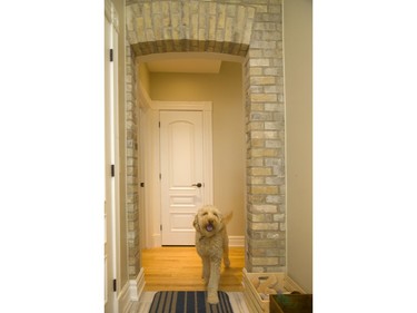 A section of preserved brick shows up in the home as a connecting hallway at 312 Wolfe St. (Mike Hensen/The London Free Press)