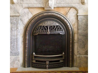 Adaptive reuse is the theme and this antique fireplace insert was reused from another location for the home at 312 Wolfe St.  (Mike Hensen/The London Free Press)