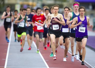 Aaron Canfield of Huron Park, led early in the senior boys 3,000 meters at TVRA track and field on Thursday May 16, 2019. Canfield was looking to post a fast time in the 3km race to get into a club this summer. But Canfield didn't get any help from Eric Klassen of Banting (768) and Matthew Mason of Laurier (pink headband) who tucked in behind Canfield for the entire race.
When Canfield started to fade Klassen, who was running in the wind the entire race, took the lead and Mason was happy to tuck in again for a bit, before blowing by Klassen on the last lap for a strong victory.
Mike Hensen/The London Free Press/Postmedia Network