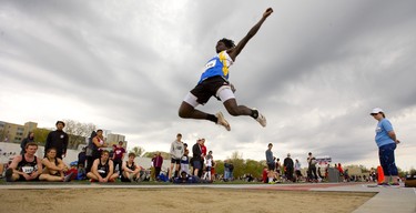 Beal's Fatorma Varfee flys through a darkening sky Thursday May 16, 2019 during the senior boys long jump at TD stadium on the second day of the TVRA track and field meet.
Mike Hensen/The London Free Press/Postmedia Network