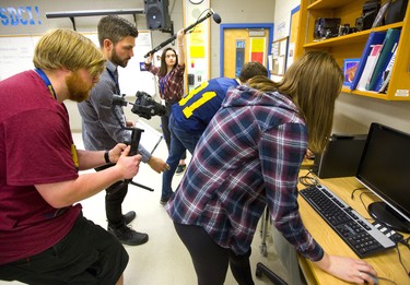 Matt Blain of London is helping Strathroy DCI students make a short film at their school. Blain was walking his assistant director of photography Eric Thompson through some shots he wanted, as Jhasna Rivas-Vasquez holds the boom mike over actors Mitchell Wolliston and Maysee McLean of Strathroy. (Mike Hensen/The London Free Press)