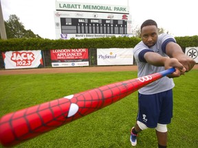 Cleveland Brownlee of the Majors is swinging a superhero bat, hopefully his spidey-senses will see a nice fast ball down the middle during their Super Heroes Day Sunday to support the Children's Hospital in London, Ont.  (Mike Hensen/The London Free Press)