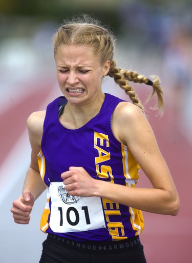 Hallee Knelsen, of East Elgin secondary school, grits her teeth as she wins the junior girls' 1,500m race Thursday, May 23, 2019 during Day 1 of the WOSSAA track and field meet at TD stadium in London.  Mike Hensen/The London Free Press