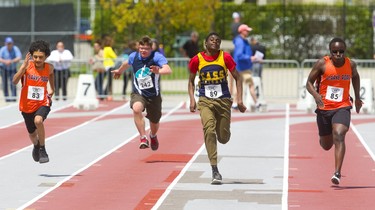 The 100m dash for developmentally delayed boys was won by Prince Sulubani, right, of Clarke Road secondary school, running against  Brandon Duenas, left, of Clarke Road, Evan Versteeg, of Listowel, and Jalei Butler, of College Avenue secondary school in Woodstock, Thursday May 23, 2019 during Day 1 of the WOSSAA track and field meet at TD stadium in London.  Mike Hensen/The London Free Press