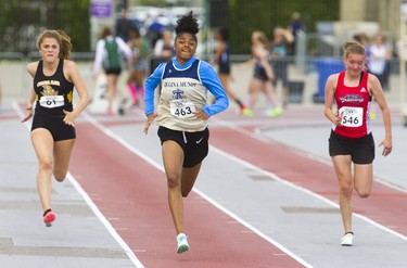 Lemyah Hylton, of Regina Mundi secondary school, wins the midget girls 100m race at WOSSAA Thursday May 23, 2019 during Day 1 of the WOSSAA track and field meet at TD stadium in London.  Mike Hensen/The London Free Press