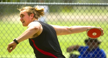 Owen Mueller, of St. Thomas Aquinas secondary school, competes in the senior boys' discus Thursday, May 23, 2019 during Day 1 of the WOSSAA track and field meet at TD stadium in London.  Mueller, with a throw of 44.01m got silver behind Ryan Jacklin, of F.E. Madill secondary school in Wingham, who had a throw of 46.24m. Mike Hensen/The London Free Press