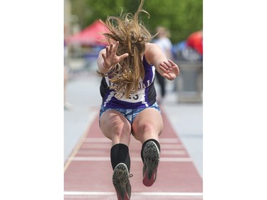 Jamie Newell of F.E. Madill secondary school in Wingham competes in the senior girls long jump during the WOSSAA track and field championship at TD Stadium in London, Ont. on Friday. (Derek Ruttan/The London Free Press)