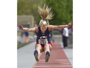 Emma Stilwell of St. Anne's Catholic secondary school in Clinton competes in the senior girl's long jump during the WOSSAA track and field championship at TD Stadium in London on Friday. (Derek Ruttan/The London Free Press)